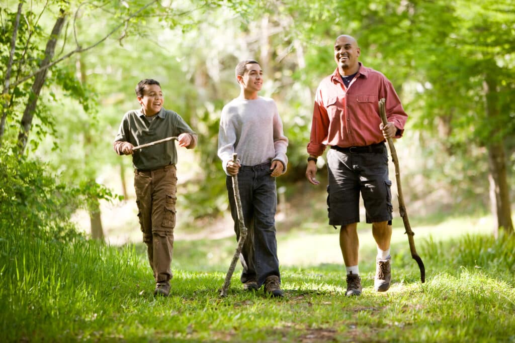 two boys on hike with their dad