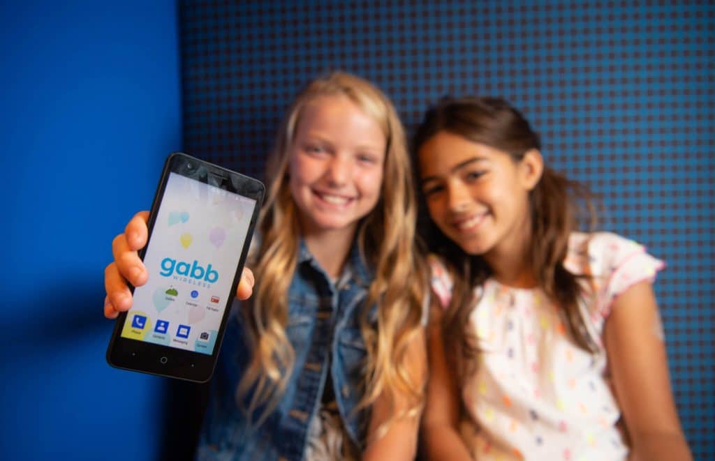Two happy girls with Gabb Z1 phone.