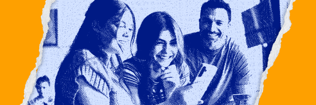 teen smiling at her phone with her family
