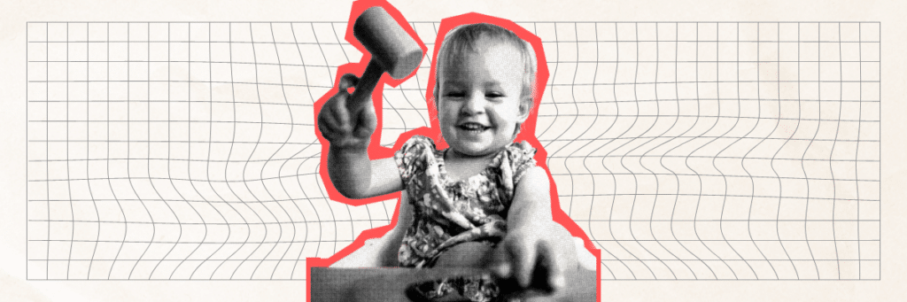 smiling baby with mallet