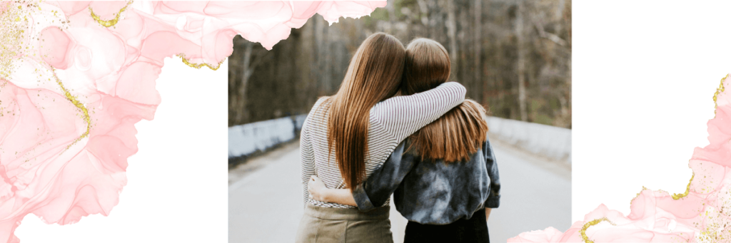two females with their arms around each other