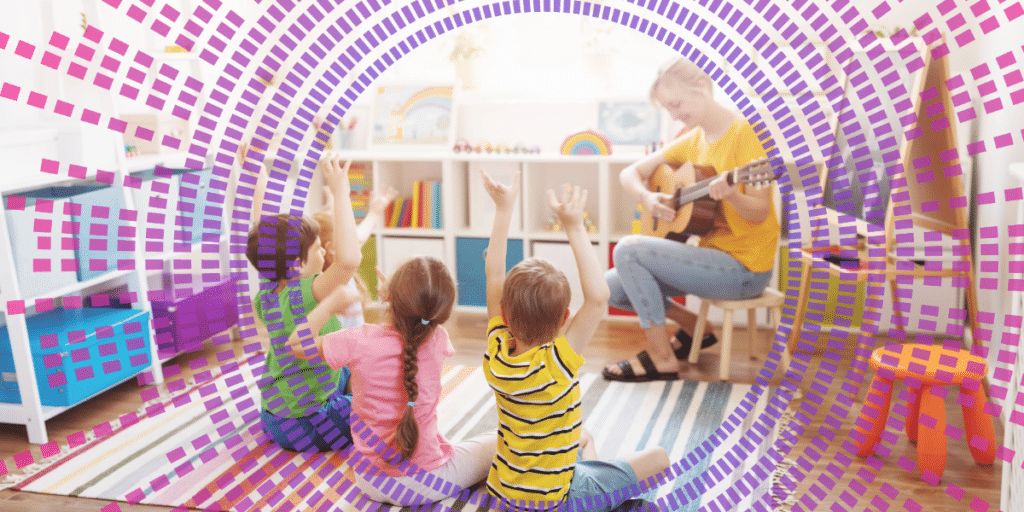 preschool kids listening to teacher playing guitar
